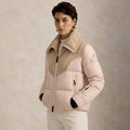 a woman wearing Quilted Ski Jacket in beige color