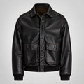 A Leather Flight Bomber Jacket with a pointed collar, front zipper, and two large flap pockets, shown on a light gray background.