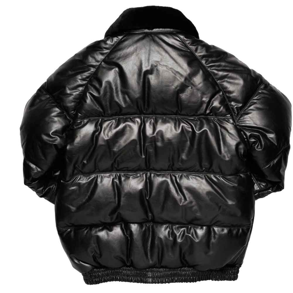 Black bomber jacket with horizontal quilting, a high collar, and ribbed hem and cuffs, shown from the back on a white background.