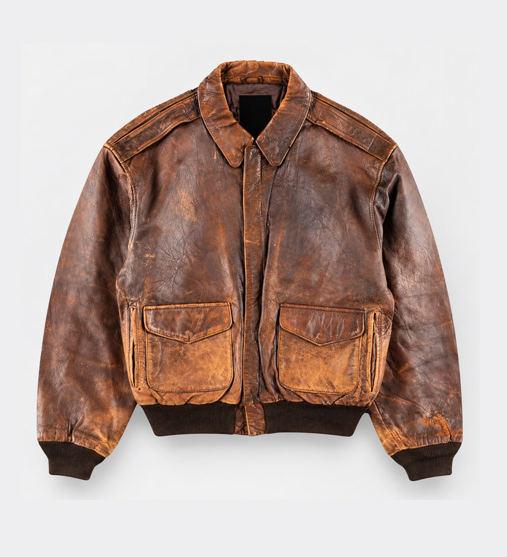 A Vintage 80s Bomber Jacket with a classic collar, front zipper, and two large flap pockets on the chest, displayed flat against a light gray background.