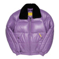 A Lilac leather puffer jacket with a black shearling collar, featuring a front zipper, horizontal quilting, and small yellow brand tags on the chest.