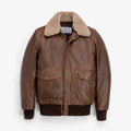 A brown Mens Bomber Jacket with Fur Collar with a thick beige shearling-style collar, featuring a front zipper, two large flap pockets, and ribbed knit cuffs and hem, shown against a plain white background.