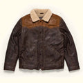 A Vintage Fur Jacket in Sheepskin Leather, a light beige sherpa collar, and front flap pockets, laid flat against a light cream background.