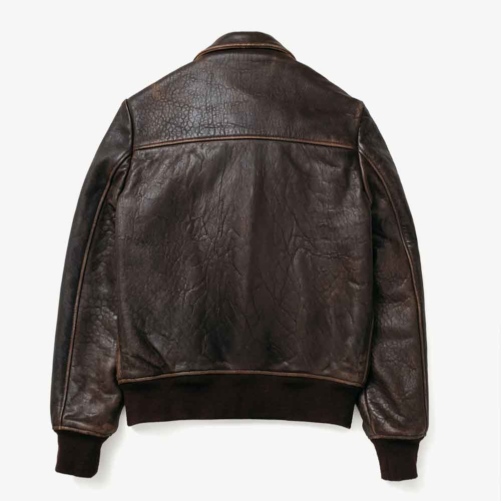 A dark brown Vintage Leather Flight Jacket shown from the back, featuring a distressed texture, contrast stitching, and ribbed knit collar, cuffs, and hem, photographed against a clean white background.
