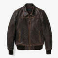 A dark brown Vintage Leather Flight Jacket with contrast stitching, a front zipper, and zippered hand pockets, shown against a plain light gray background.