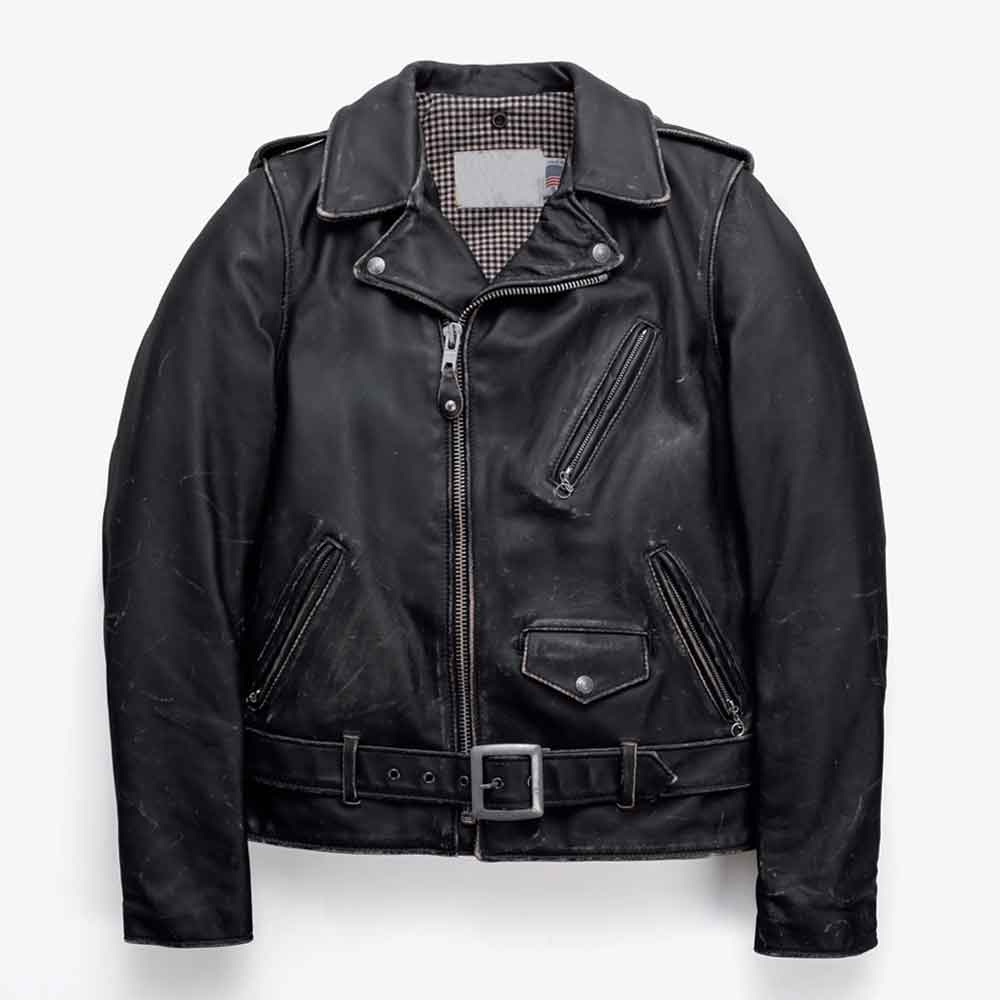 A black leather motorcycle jacket with a zippered front, belted waist, and diagonal zip pockets, shown flat against a light gray background.