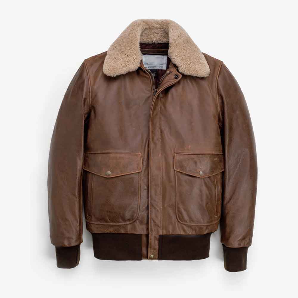 A Vintage Mens Jacket in G1 Bomber Style with a beige shearling-style collar, featuring a front zipper, two large flap pockets, and ribbed knit cuffs and hem, shown against a plain light gray background.