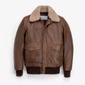 A Vintage Mens Jacket in G1 Bomber Style with a beige shearling-style collar, featuring a front zipper, two large flap pockets, and ribbed knit cuffs and hem, shown against a plain light gray background.