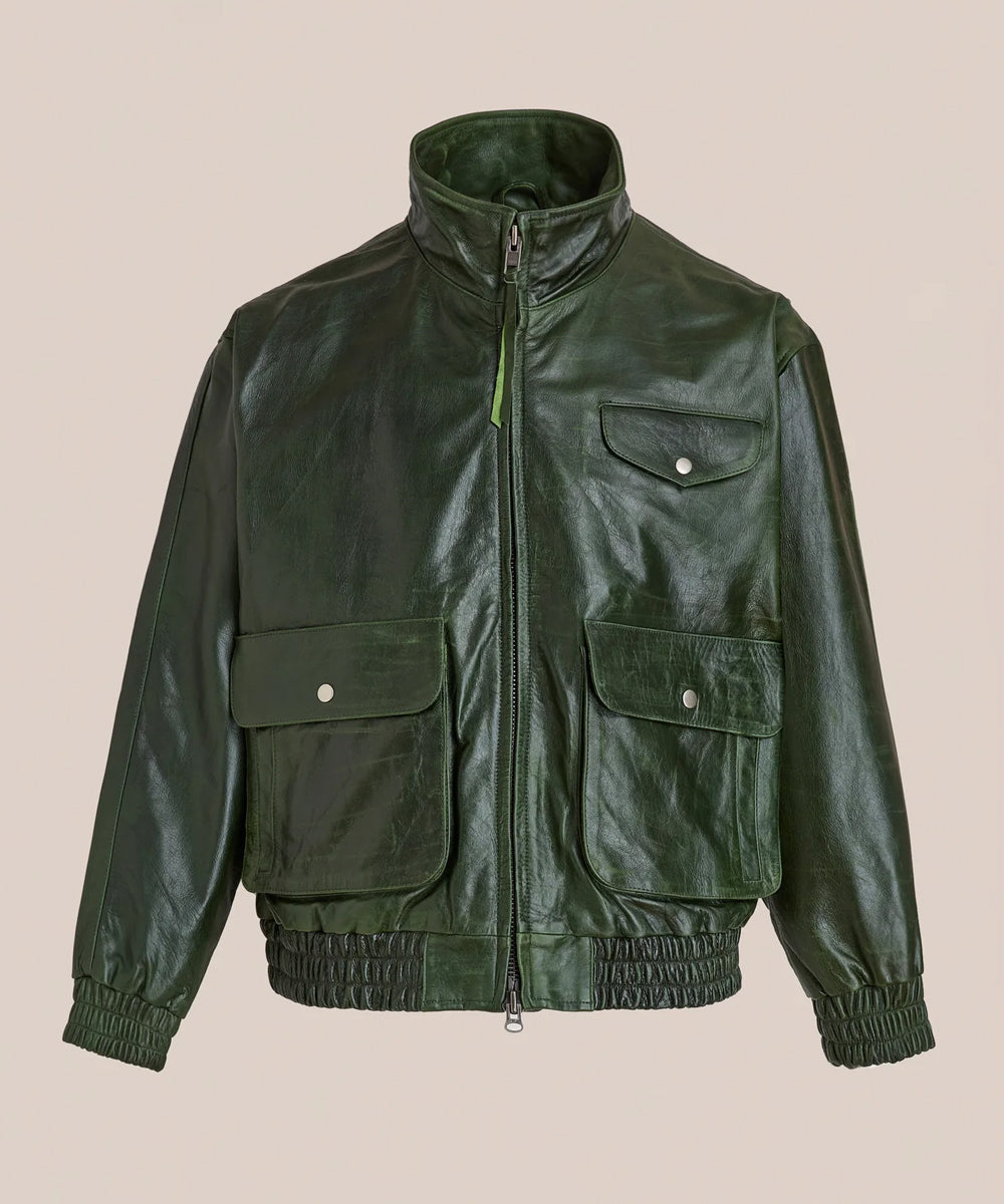 A dark Vintage Green Bomber Jacket with a stand-up collar, front zipper, and four front flap pockets, displayed against a solid beige background.