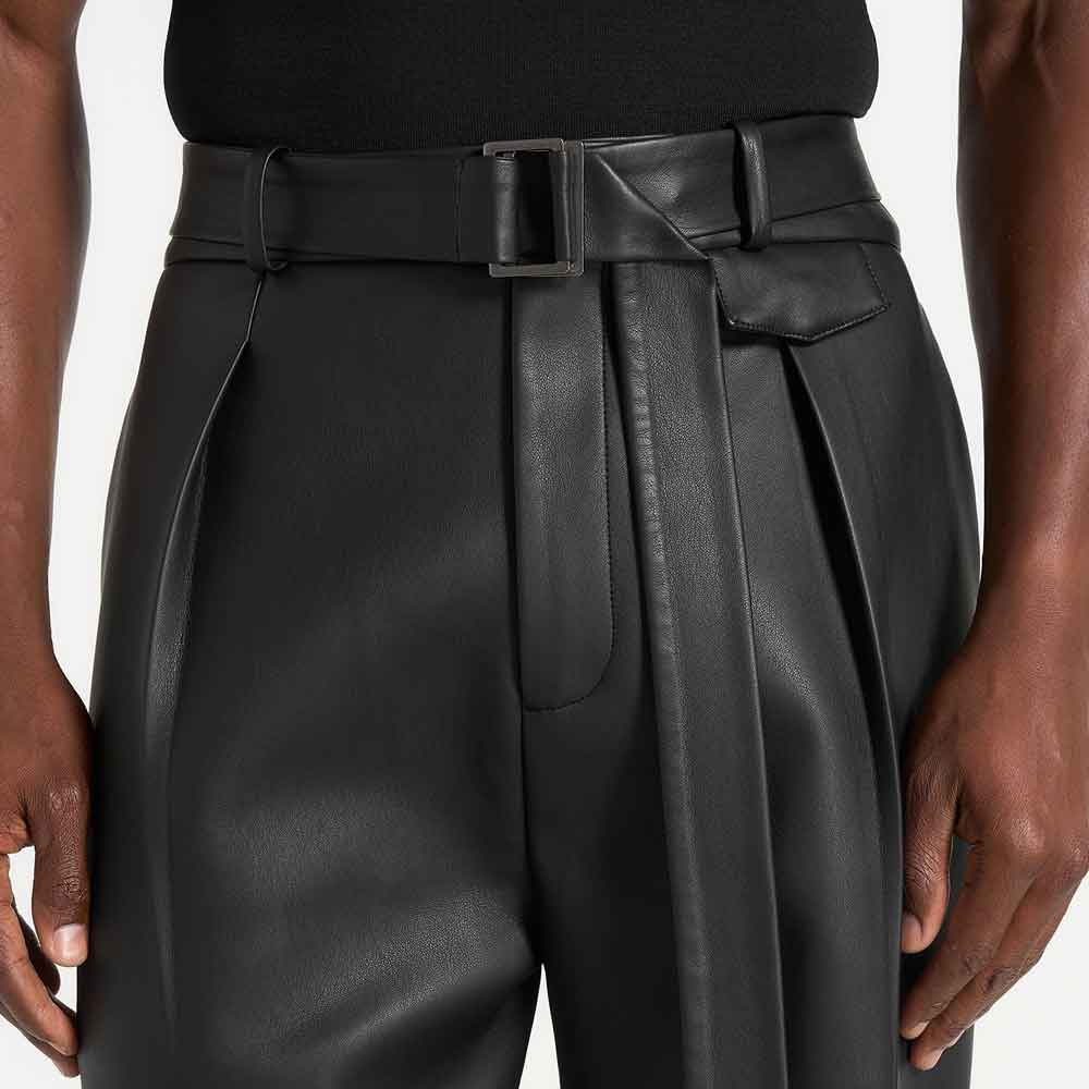 front close up view of a man wearing wide leather pants